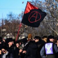 Members of anarchists groups stage a protest on February 4, 2023 outside the Carcere di Opera prison in Milan, where anarchist Alfredo Cospito is incarcerated under the "41-bis" highly restrictive detention regime, and who is on hunger strike for over 100 days. - The failing health of an incarcerated anarchist has rekindled debate in Italy over hard prison time usually reserved for mafia bosses, with the new right-wing government vowing not to cave in. Around 730 people behind bars in Italy are subject to the country's highly restrictive detention regime known as "41-bis", among them anarchist Alfredo Cospito, 55. (Photo by Piero CRUCIATTI / AFP)